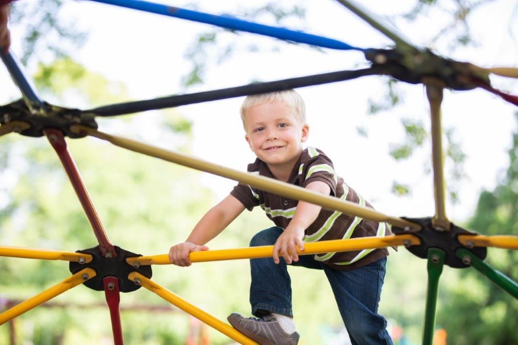 boy on park equipment